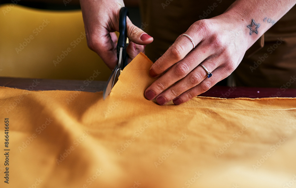 Obraz premium Hands, scissors and designer with fabric, clothing manufacturing and cutting. Woman, seamstress and dressmaker with textile material, tailor and production for creative sewing in small business