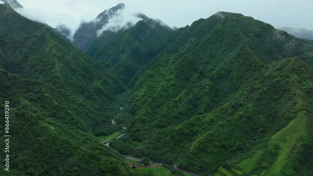 Tahiti French Polynesia Teahupoo aerial drone raining fog up the mountain peaks river morning grey gray season wet green Point Faremahora village town South Pacific Mount Tohivea island forward motion Tahiti French Polynesia Teahupoo aerial drone raining fog up the mountain peaks river morning grey gray season wet green Point Faremahora village town South Pacific Mount Tohivea island forward motion