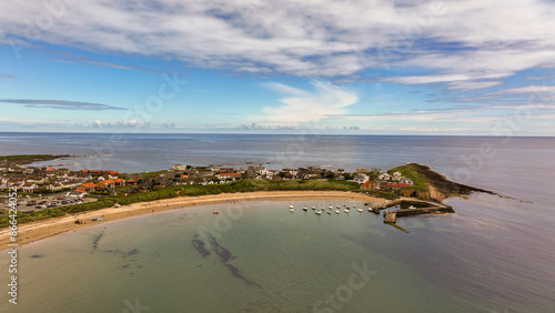 Tableau sur toile Beadnell village is set at the end of a sheltered, horseshoe-shaped beach called Beadnell Bay
