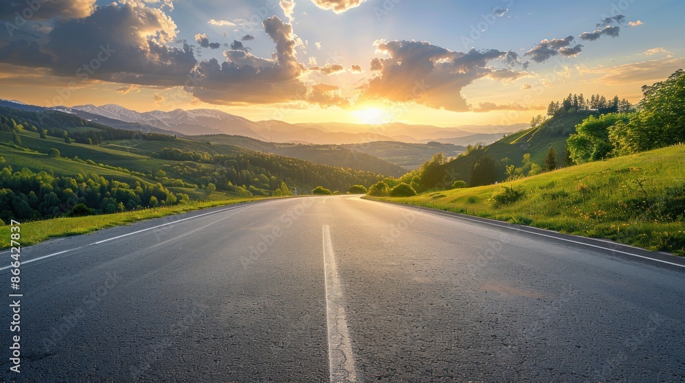 Asphalt highway road and green mountain with sky clouds at sunset Asphalt highway road and green mountain with sky clouds at sunset