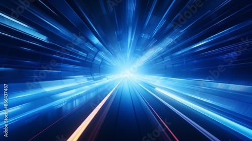 A spectacular futuristic blue tunnel with radiating light beams at the end, creating a sense of motion and speed. Perfect for representing futuristic or technological concepts.