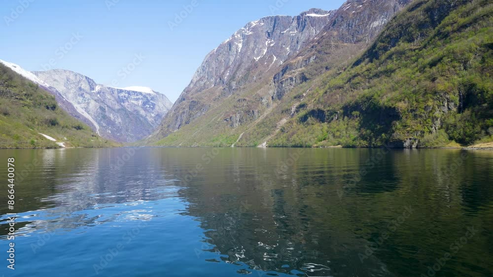 Along the way there are snow-capped mountains, waterfalls and lake reflections. Cruise the World Heritage Sognefjord and enjoy the beautiful scenery. Norway. Along the way there are snow-capped mountains, waterfalls and lake reflections. Cruise the World Heritage Sognefjord and enjoy the beautiful scenery. Norway.