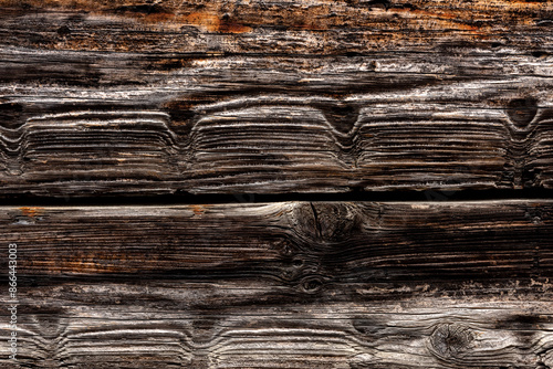 Dark rustic burnt wood rough texture. Abstract backgroung