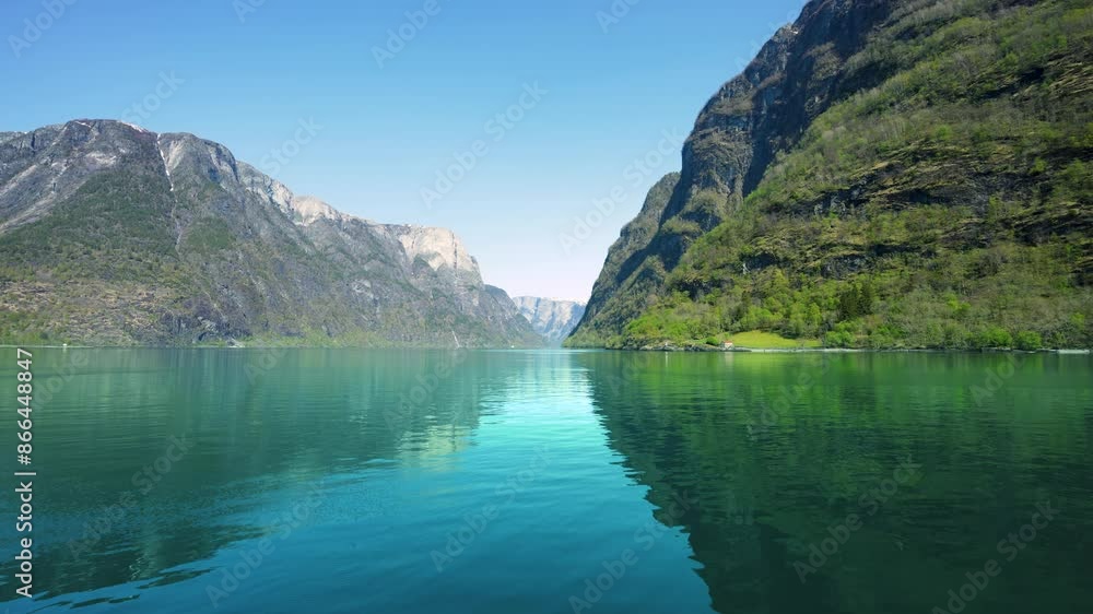 Along the way there are snow-capped mountains, waterfalls and lake reflections. Cruise the World Heritage Sognefjord and enjoy the beautiful scenery. Norway. Along the way there are snow-capped mountains, waterfalls and lake reflections. Cruise the World Heritage Sognefjord and enjoy the beautiful scenery. Norway.