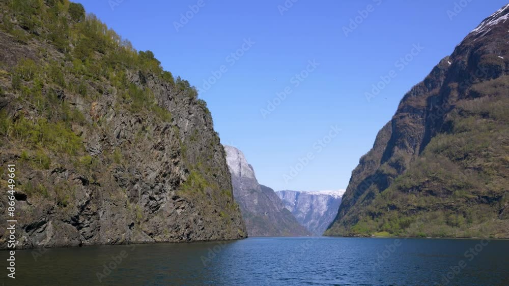 Along the way there are snow-capped mountains, waterfalls and lake reflections. Cruise the World Heritage Sognefjord and enjoy the beautiful scenery. Norway. Along the way there are snow-capped mountains, waterfalls and lake reflections. Cruise the World Heritage Sognefjord and enjoy the beautiful scenery. Norway.