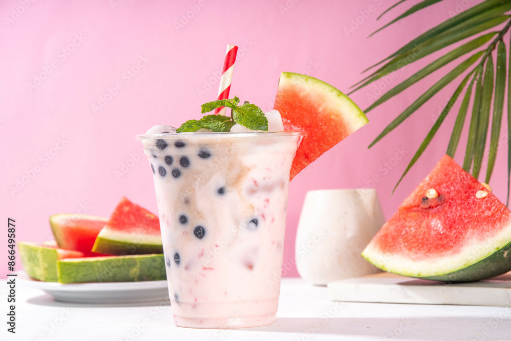 Watermelon boba balls bubble tea cocktail. Refreshing milky non-dairy milkshake cocktail with boba balls and watermelon slices on background. Summer garnished sweet dessert iced drink Watermelon boba balls bubble tea cocktail. Refreshing milky non-dairy milkshake cocktail with boba balls and watermelon slices on background. Summer garnished sweet dessert iced drink