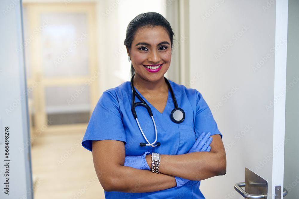 Hospital, woman and happy as surgeon with arms crossed for healthcare service with stethoscope and confident. Clinic, medical doctor and smile or proud for surgery or operation success with gloves Hospital, woman and happy as surgeon with arms crossed for healthcare service with stethoscope and confident. Clinic, medical doctor and smile or proud for surgery or operation success with gloves