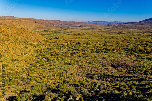 Landscape of Karoo mountains and valley with green vegetation after winter rains in the Karoo National Park, Western Cape, South Africa photo