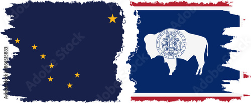 Wyoming and Alaska states grunge brush flags connection vector