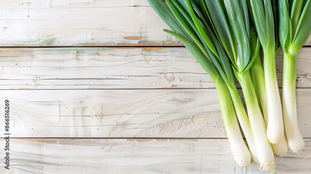 copy space, stockphoto, close-up leeks on a light wooden table. Fresh vegetableson a wooden background. Healthy food in local market. Source of vitamines and antioxidants. copy space, stockphoto, close-up leeks on a light wooden table. Fresh vegetableson a wooden background. Healthy food in local market. Source of vitamines and antioxidants.