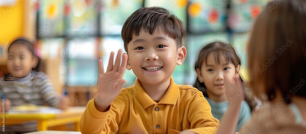 Smiling Boy Raises Hand in Classroom Smiling Boy Raises Hand in Classroom