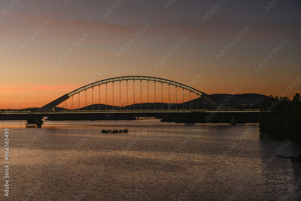 Naklejka premium Lusitania Bridge Silhouetted Against Sunset, Merida, Spain