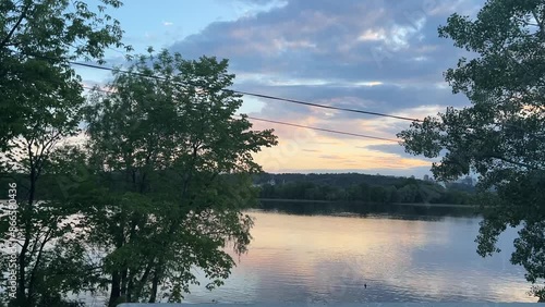 Beautiful sunset in summer on Dnipro river in Kyiv city in Ukraine, colorful sky