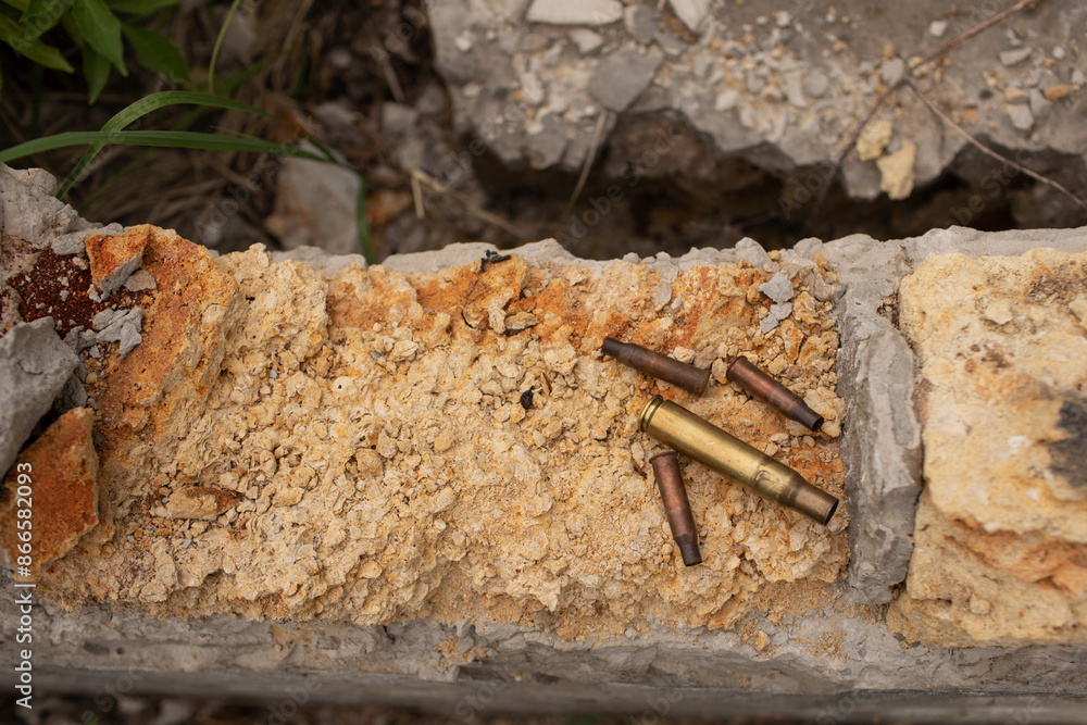 several large and small shell casings lie on part of the destroyed building several large and small shell casings lie on part of the destroyed building