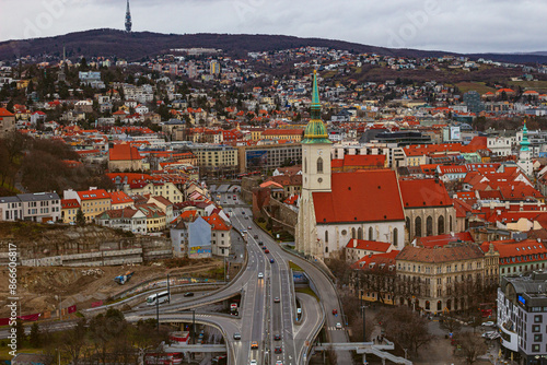 Breathtaking view from the top of the Ufo tower on the St. Martin Cathedral, SNP bridge and old town with red tiles in Bratislava, Slovakia	 photo