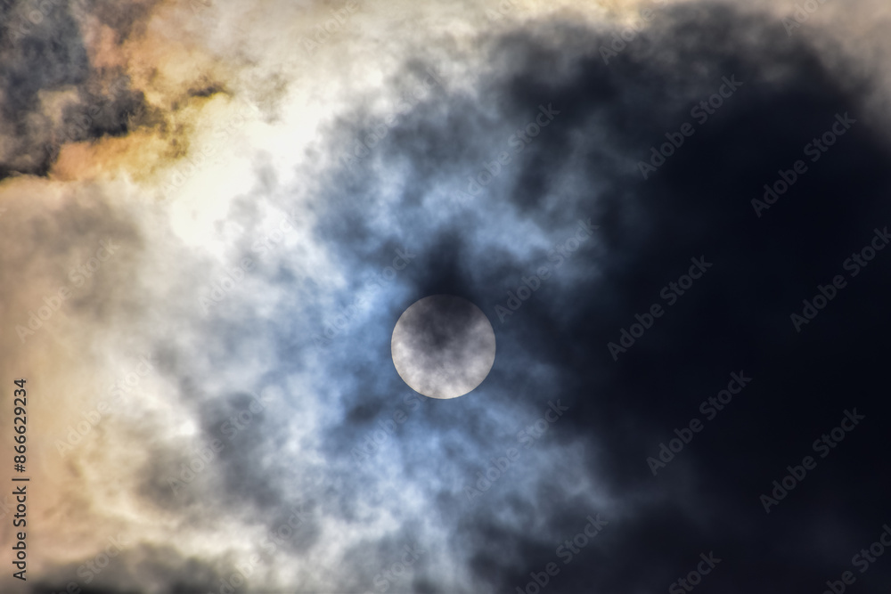 Full moon with dramatic cloudscape. Cloudy overcast sky with moon. Nature scene.