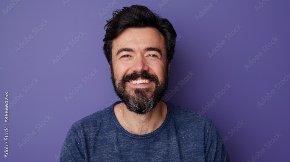 middle aged man with beard smiling at camera on purple background in high resolution middle aged man with beard smiling at camera on purple background in high resolution