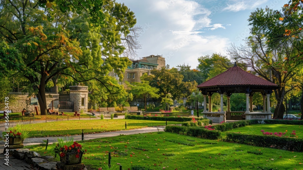 A picturesque city park with adaptive reuse of old structures turned into green spaces. A picturesque city park with adaptive reuse of old structures turned into green spaces.