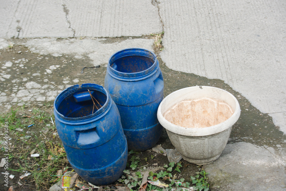 Large jerry cans and plant pots are reused as rubbish bins Large jerry cans and plant pots are reused as rubbish bins