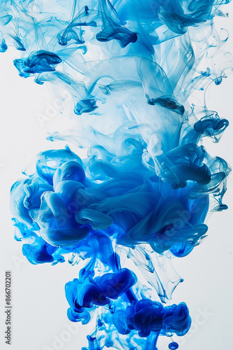 Vivid blue ink swirling in water, creating mesmerizing patterns and abstract art, emphasizing creativity and fluidity.
