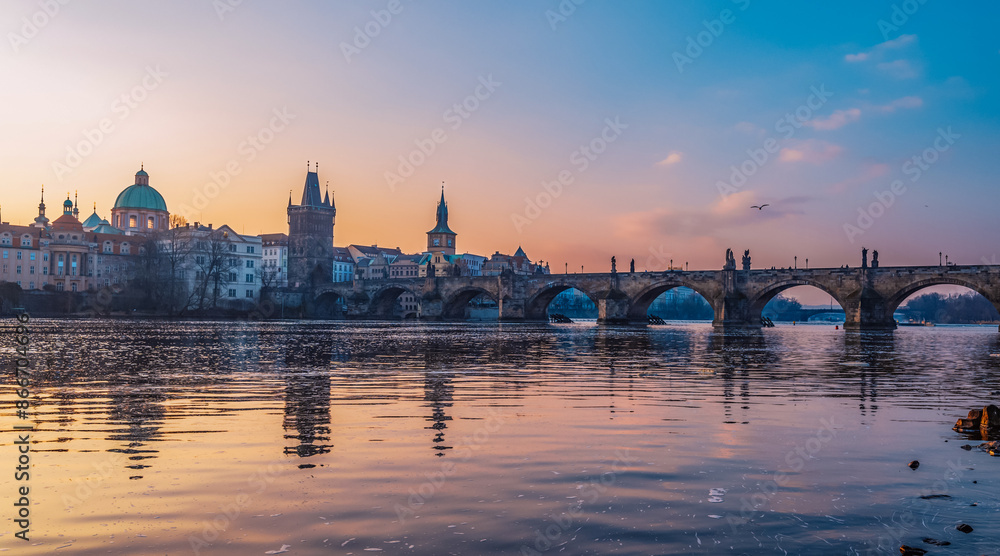 View of the city of Prague. Vltava river with Old Town Bridge Tower on Charles bridge in Prague, Czech Republic. View of the city of Prague. Vltava river with Old Town Bridge Tower on Charles bridge in Prague, Czech Republic.