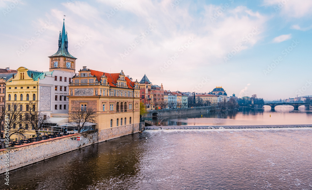 Fototapeta premium View of the city of Prague and the Vltava river with Old Town Bridge Tower on Charles bridge in Prague, Czech Republic.