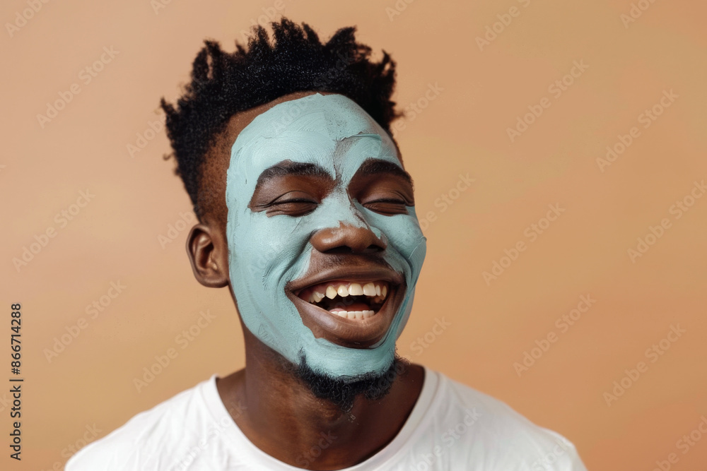 A cheerful African American man with a clay mask on his face, showing happiness and relaxation A cheerful African American man with a clay mask on his face, showing happiness and relaxation