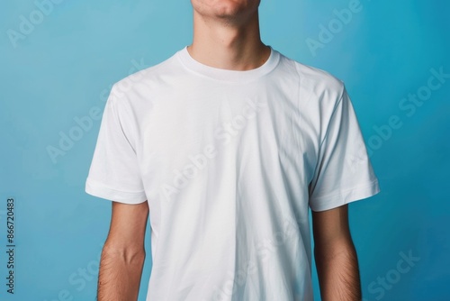 A person holding a skateboard, possibly getting ready to ride