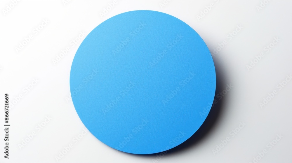 Fototapeta premium A blue round paper sticker on a white background