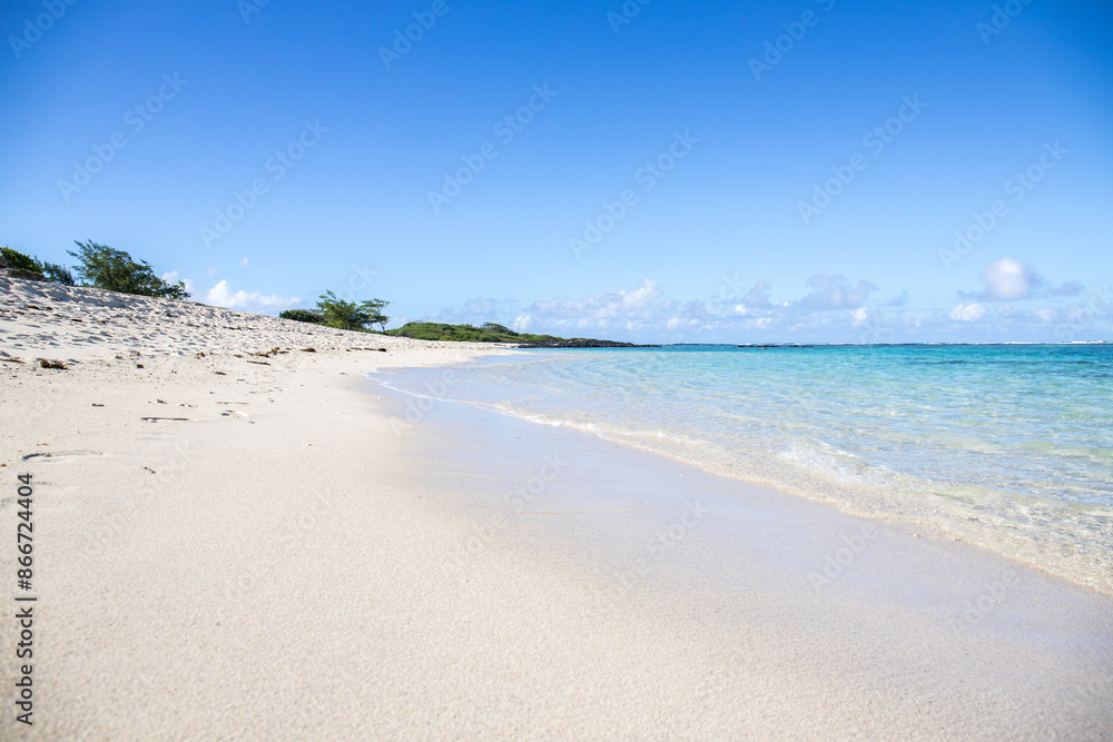 Fantastic sandy beach in the morning. An island in the Indian Ocean, landscape photo or seascape with the sun rising over the sea. There are small lava rocks on the beach
Trou d'Eau Douce, Mauritius Fantastic sandy beach in the morning. An island in the Indian Ocean, landscape photo or seascape with the sun rising over the sea. There are small lava rocks on the beach
Trou d'Eau Douce, Mauritius