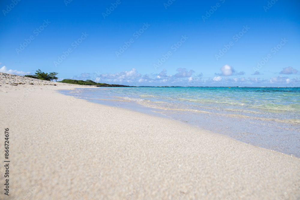 Fantastic sandy beach in the morning. An island in the Indian Ocean, landscape photo or seascape with the sun rising over the sea. There are small lava rocks on the beach
Trou d'Eau Douce, Mauritius Fantastic sandy beach in the morning. An island in the Indian Ocean, landscape photo or seascape with the sun rising over the sea. There are small lava rocks on the beach
Trou d'Eau Douce, Mauritius