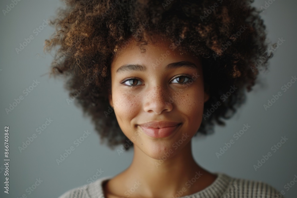 Close-up portrait of a person with afro hair, great for personal or business use Close-up portrait of a person with afro hair, great for personal or business use