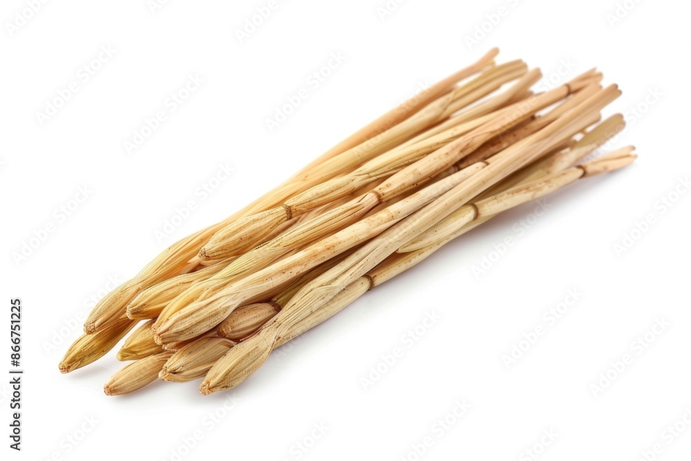 A collection of wooden sticks arranged on a white surface A collection of wooden sticks arranged on a white surface