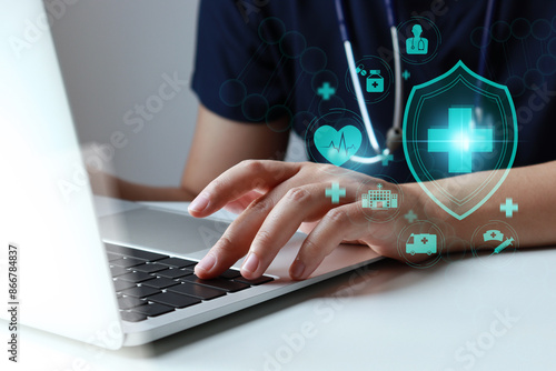 Health Insurance, healthcare business, medical and hospital. Doctor using laptop.