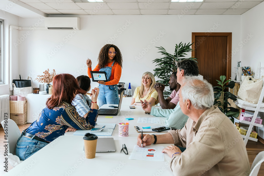 Diverse team engaging in coworking space with technology Diverse team engaging in coworking space with technology