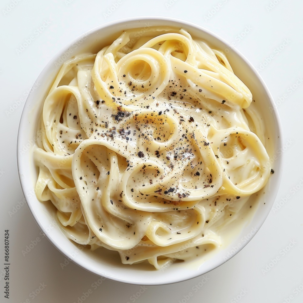 Creamy Alfredo Sauce minimal, on white background, top view Creamy Alfredo Sauce minimal, on white background, top view