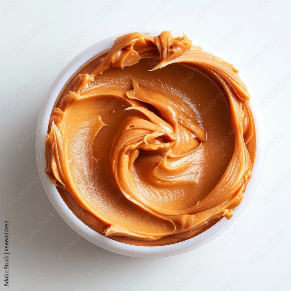 Smooth Peanut Butter Sauce minimal, on white background, top view Smooth Peanut Butter Sauce minimal, on white background, top view