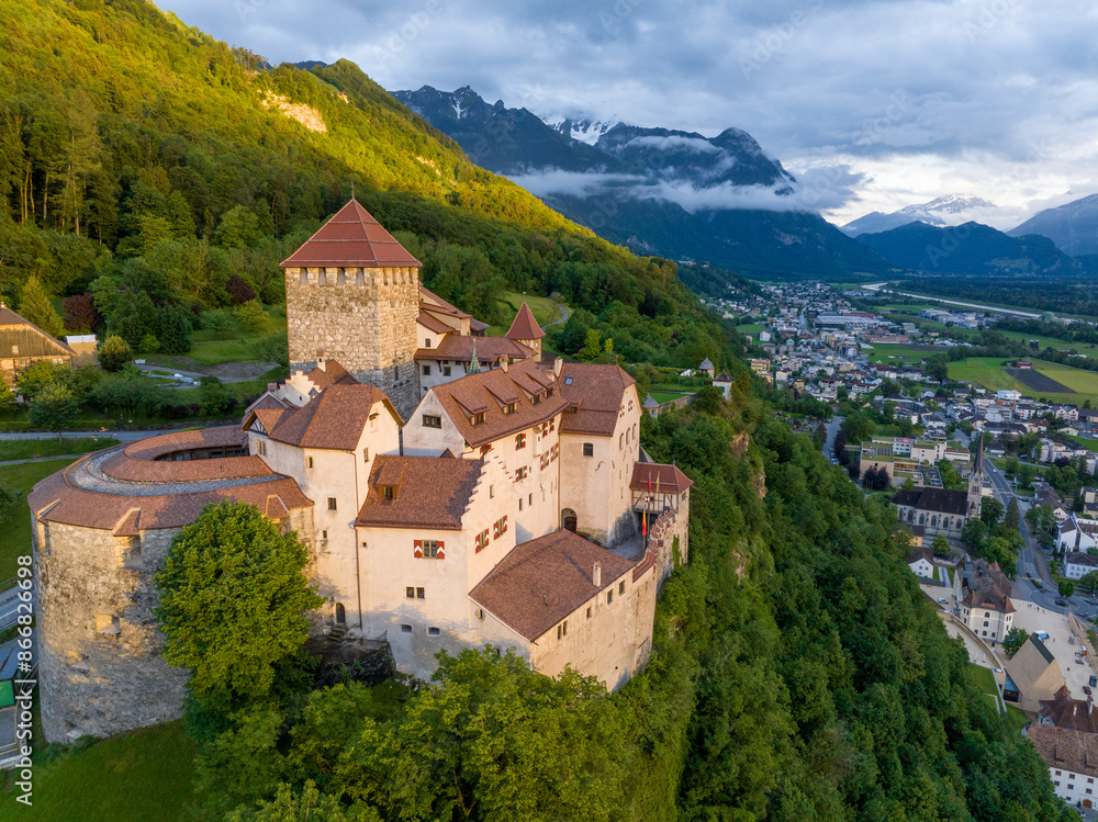 Vaduz Castle in Liechtenstein. Picturesque view of fairytale castle in Alps mountains at Sunset Time. A Landmark Aerial