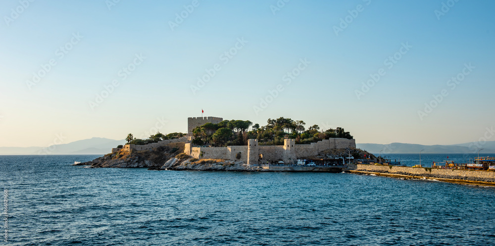 Guvercinada Island (Pigeon Island) and Guvercinada Castle in Kusadasi. Aydin, Turkey. Kusadasi is a popular tourist destination in Turkey. Guvercinada Island (Pigeon Island) and Guvercinada Castle in Kusadasi. Aydin, Turkey. Kusadasi is a popular tourist destination in Turkey.