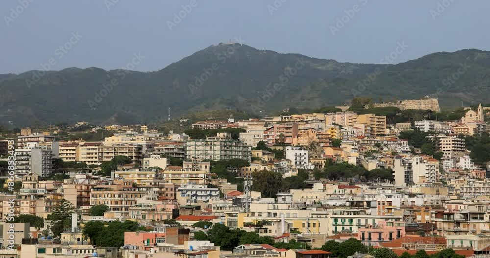 Messina Sicily port city buildings pan. Largest port in Mediterranean, Busiest passenger port in Europe. Harbor city. Historical buildings and churches. Cathedral of Messina. Messina Sicily port city buildings pan. Largest port in Mediterranean, Busiest passenger port in Europe. Harbor city. Historical buildings and churches. Cathedral of Messina.
