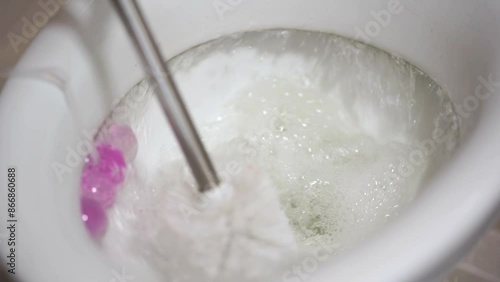 Wallpaper Mural A man flushes the toilet.
Toilet frill.
A man cleans the toilet with a brush. Torontodigital.ca