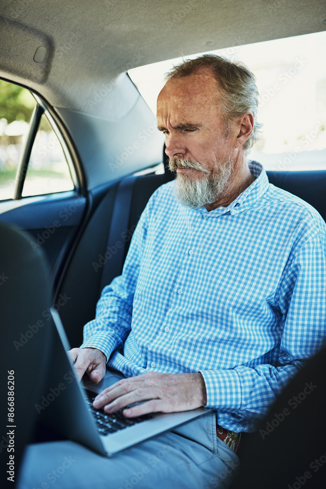 Senior man, typing and laptop in car backseat for work, travel with tech for sales company. Male person, computer and admin tasks in transport with internet, search on database with commitment Senior man, typing and laptop in car backseat for work, travel with tech for sales company. Male person, computer and admin tasks in transport with internet, search on database with commitment