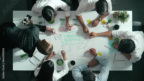 Top view of professional business team working together to brainstorm environmental idea by using mind map. Aerial view of smart manager talking and discussing about sustainable energy. Alimentation. photo