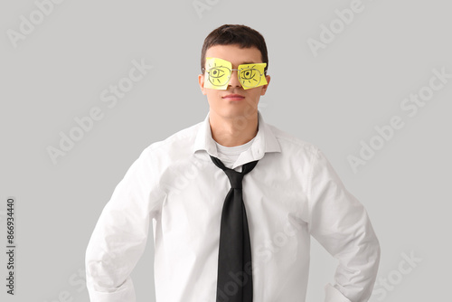 Tired young businessman wit...