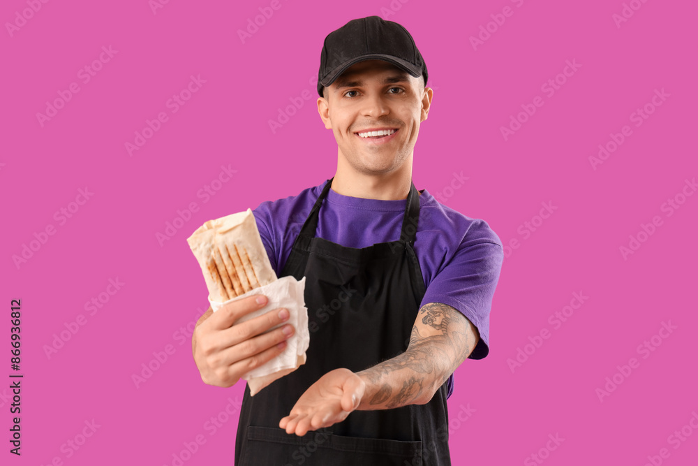 Chef with tasty doner kebab on purple background Chef with tasty doner kebab on purple background
