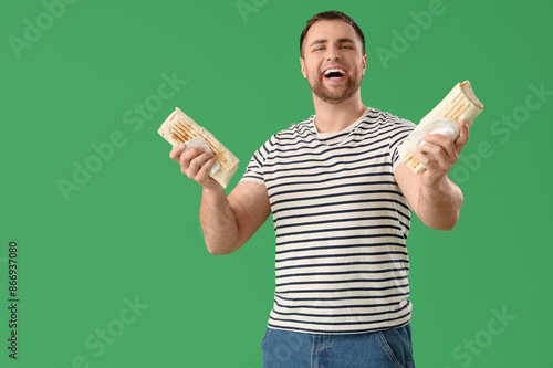 Happy young man with tasty ...