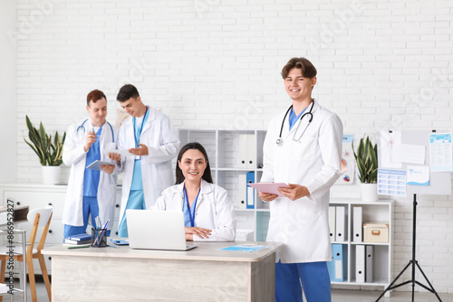 Young doctors working at ta...