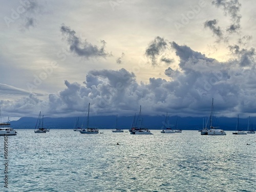 seascape of guadeloupe in the french west indies with view of sailboats on the caribbean sea at sunset of a cloudy day
 photo