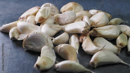 Wallpaper Mural close up pf garlic dropping on a table  Torontodigital.ca