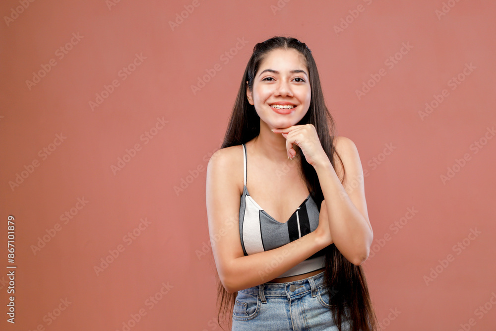 A Stylish Model In A Stylish Outfit Holds Her Hand Under Her Chin A Stylish Model In A Stylish Outfit Holds Her Hand Under Her Chin
